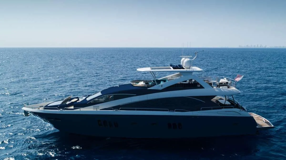 a white yacht in the water aboard THE CABANA Yacht for Sale
