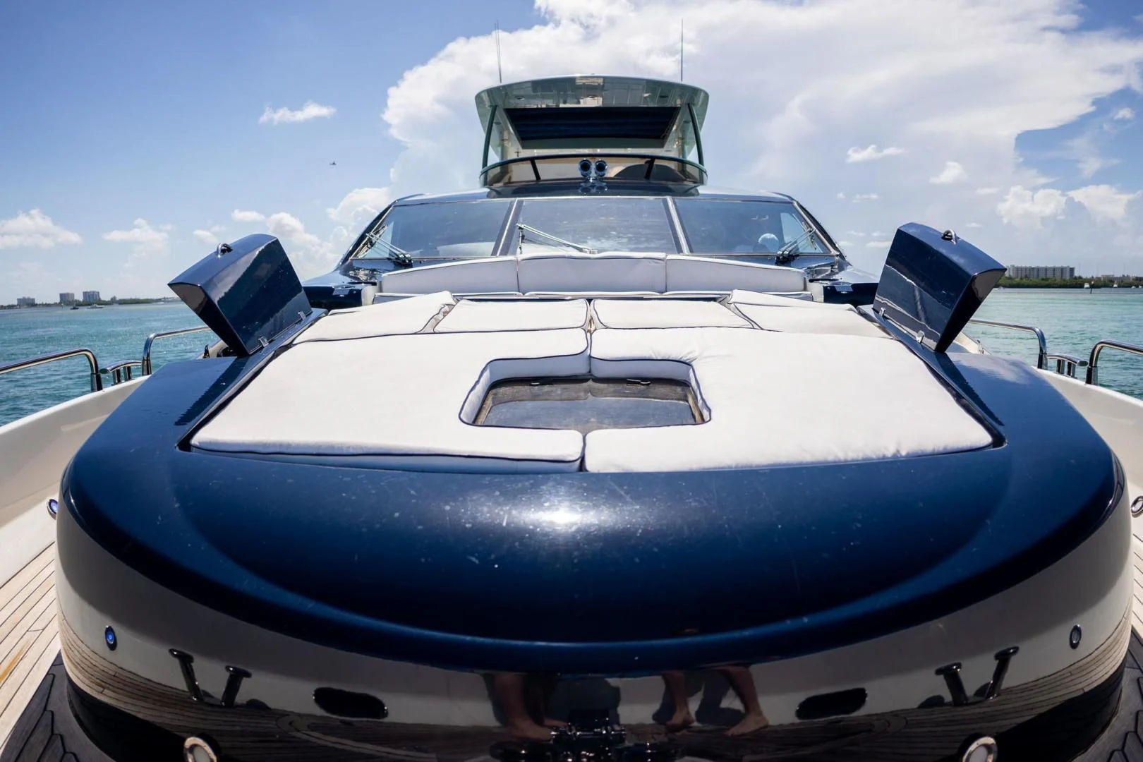 a white and blue boat aboard THE CABANA Yacht for Sale
