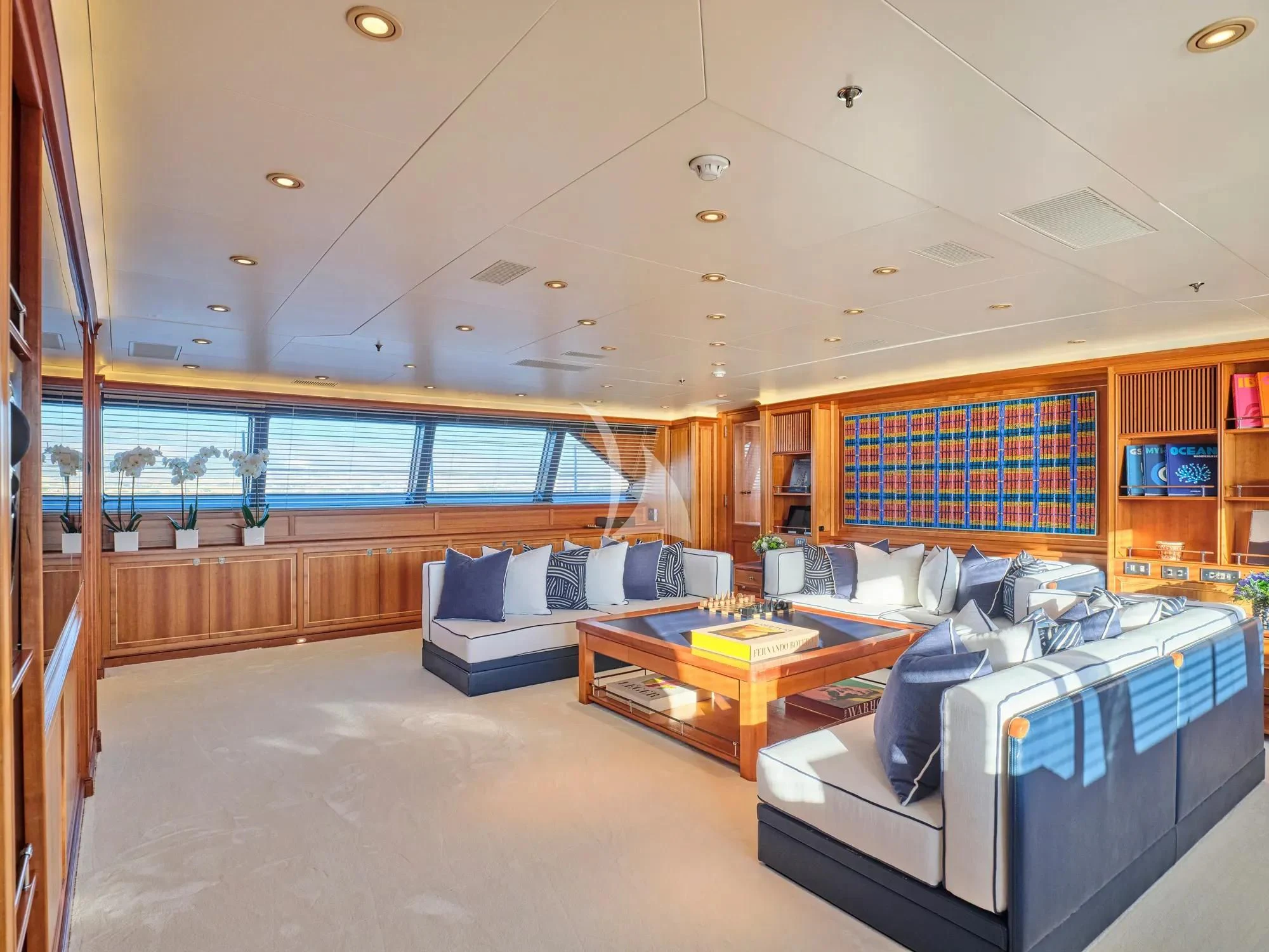 a room with a bed and a table aboard BURRASCA Yacht for Sale