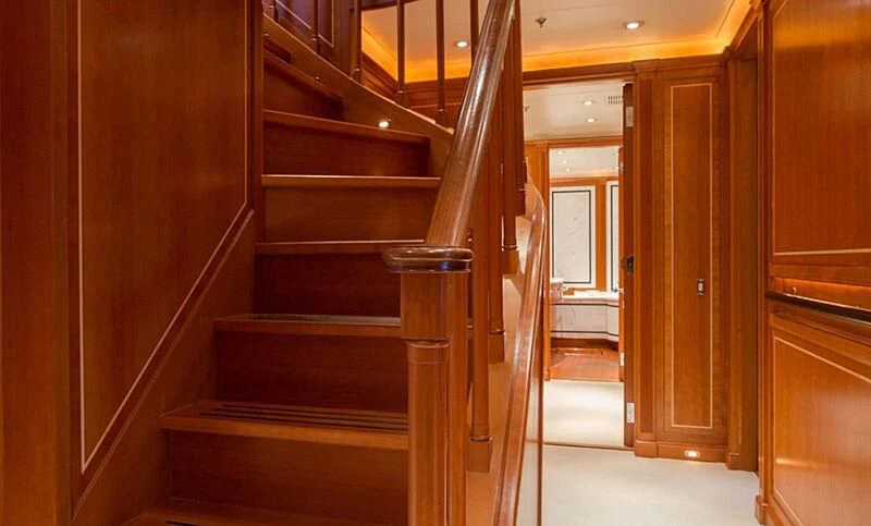 a wooden staircase in a house aboard BURRASCA Yacht for Sale