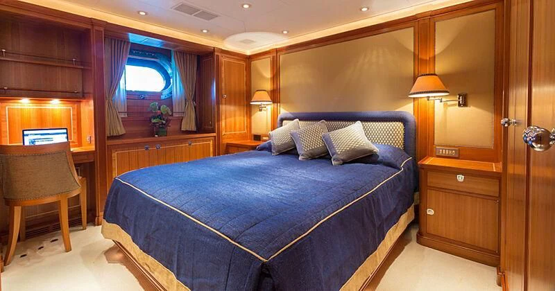 a bed in a room aboard BURRASCA Yacht for Sale