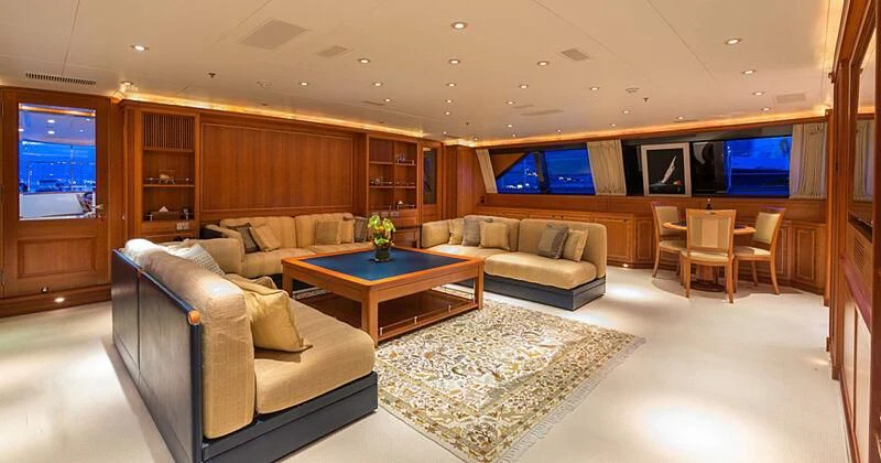 a living room with a couch and a table aboard BURRASCA Yacht for Sale