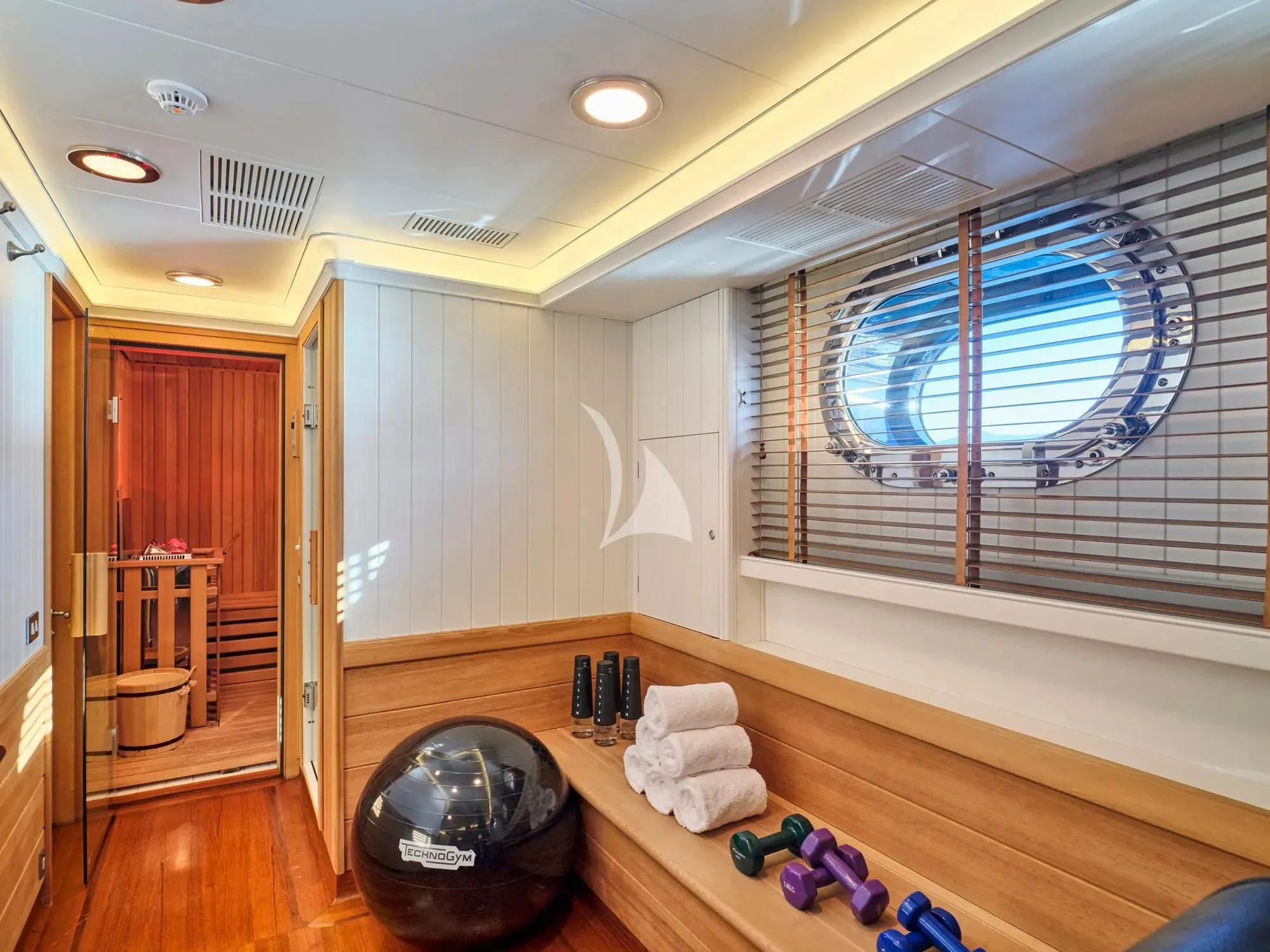 a room with a large mirror and a large window aboard BURRASCA Yacht for Sale