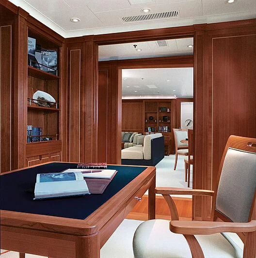 a room with a table and chairs aboard BURRASCA Yacht for Sale