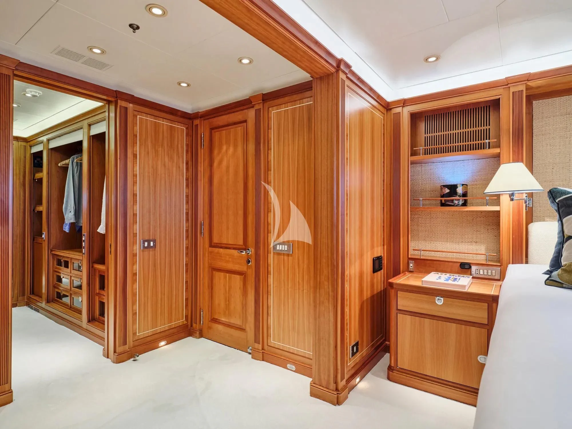 a room with wooden cabinets aboard BURRASCA Yacht for Sale