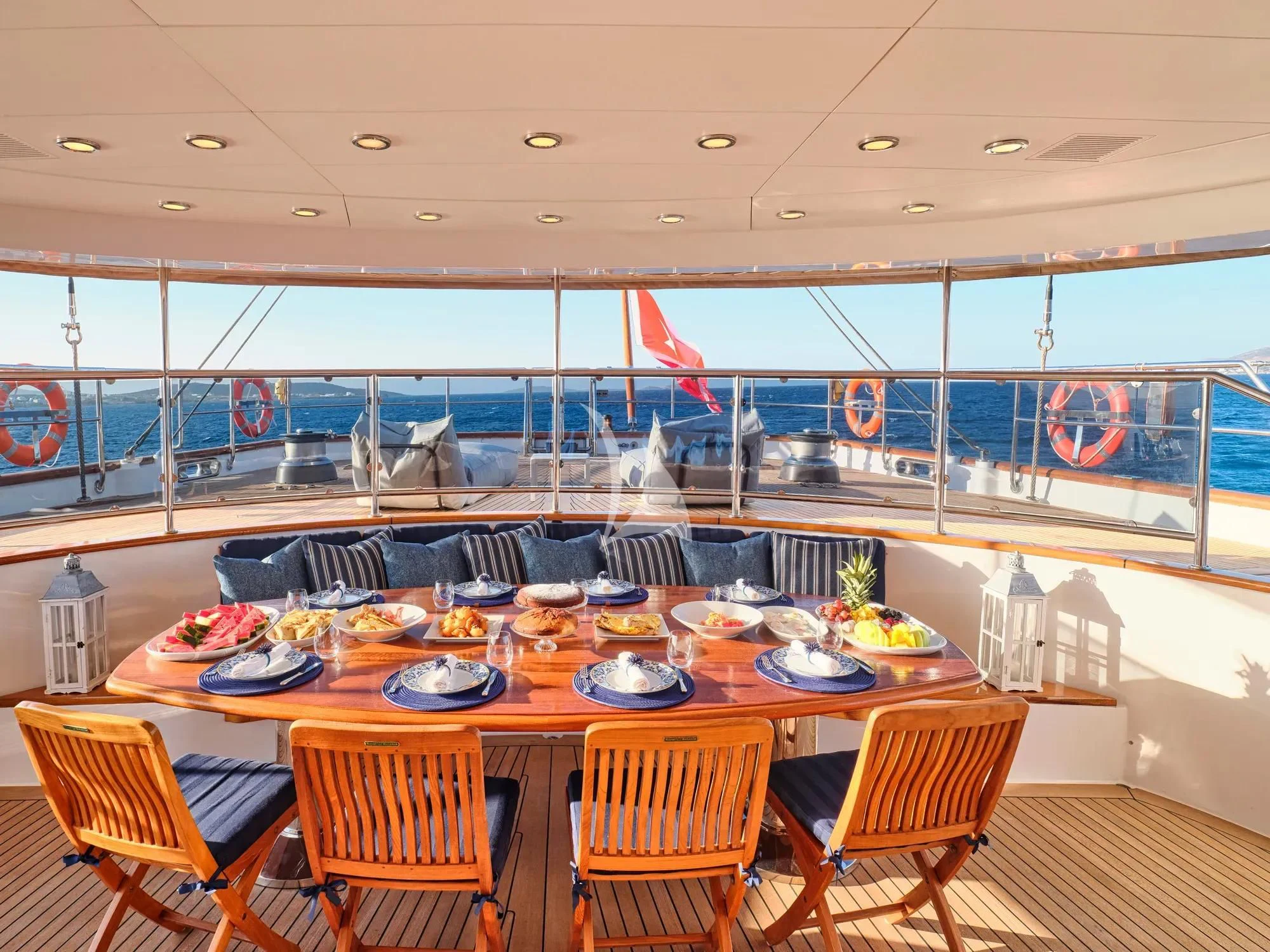 a dining room with a table set aboard BURRASCA Yacht for Sale