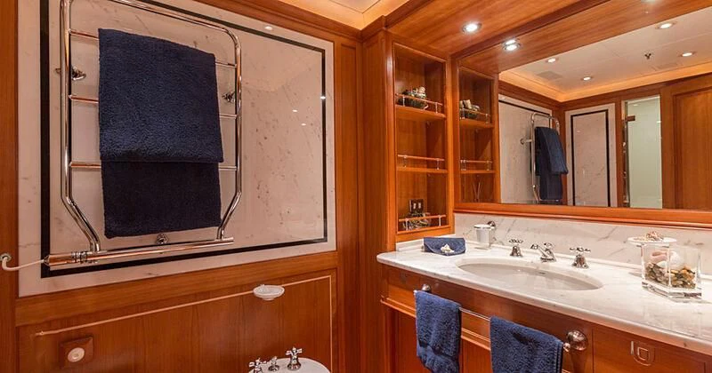 a bathroom with a large mirror aboard BURRASCA Yacht for Sale