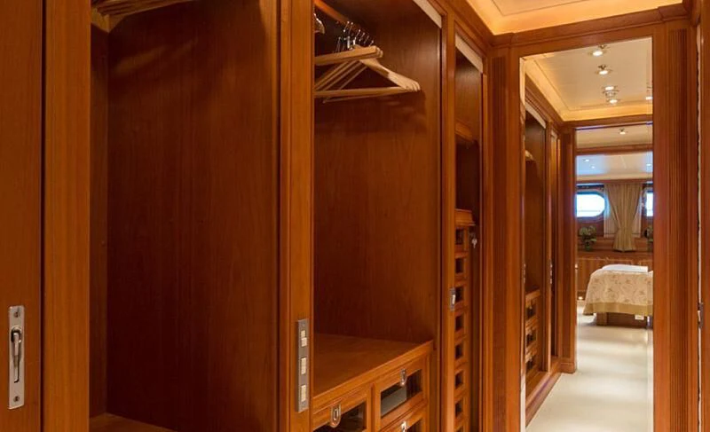 a room with a closet and a bed aboard BURRASCA Yacht for Sale