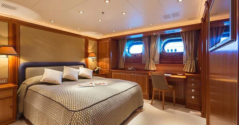 a bed in a room aboard BURRASCA Yacht for Sale