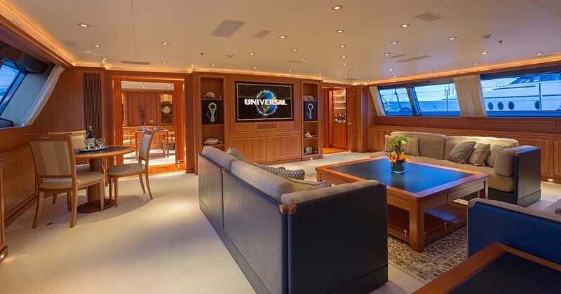 a living room with a couch and a table aboard BURRASCA Yacht for Sale
