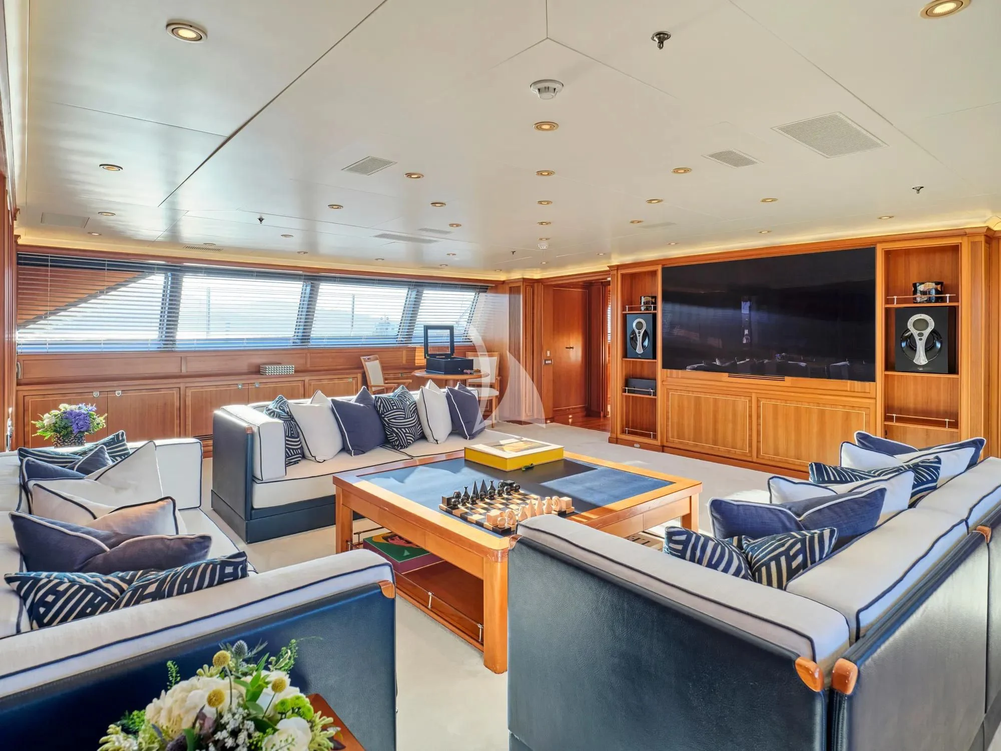 a living room with a couch and a table aboard BURRASCA Yacht for Sale