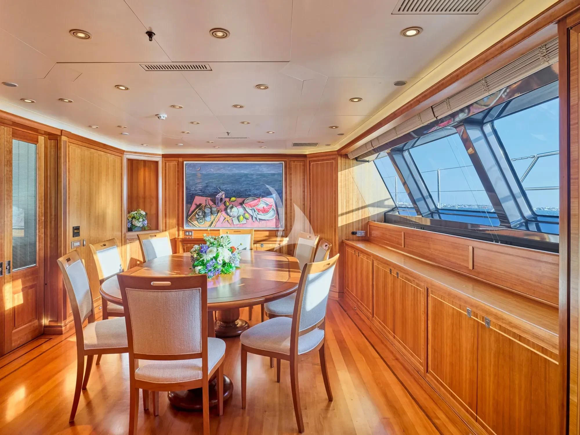 a dining room with a table aboard BURRASCA Yacht for Sale