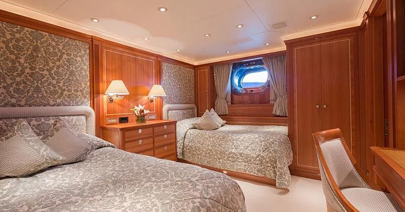 a room with a bed and a window aboard BURRASCA Yacht for Sale