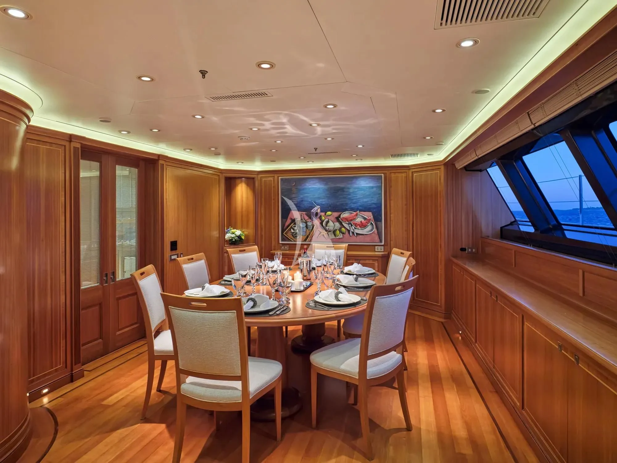 a dining room with a table and chairs aboard BURRASCA Yacht for Sale
