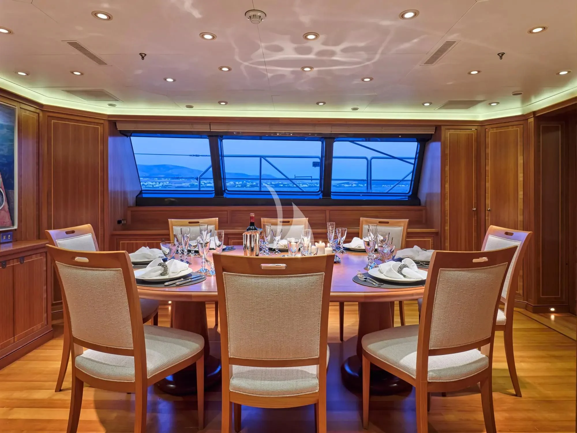 a dining room with a table and chairs aboard BURRASCA Yacht for Sale