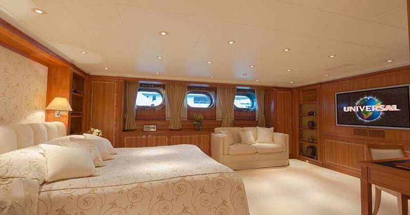 a room with a bed and a tv aboard BURRASCA Yacht for Sale