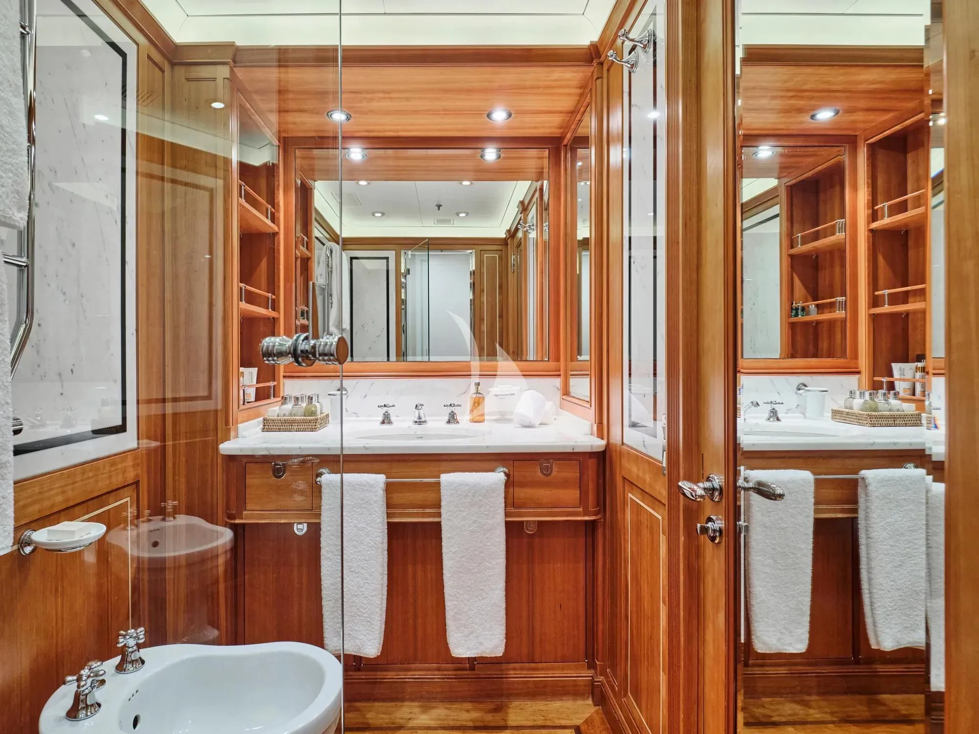 a bathroom with a sink and a mirror aboard BURRASCA Yacht for Sale