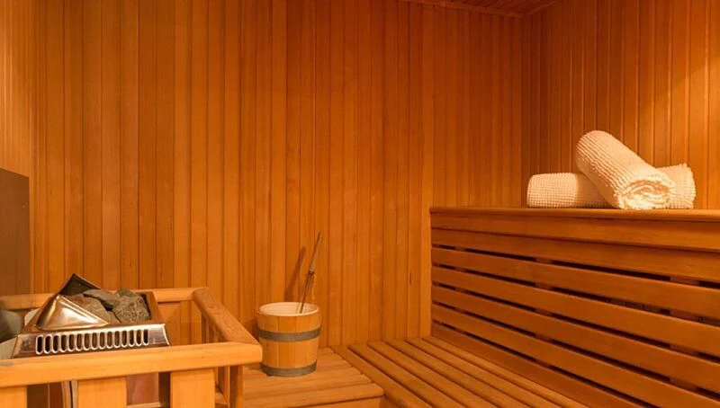 a wood desk with a keyboard and a basket on it aboard BURRASCA Yacht for Sale