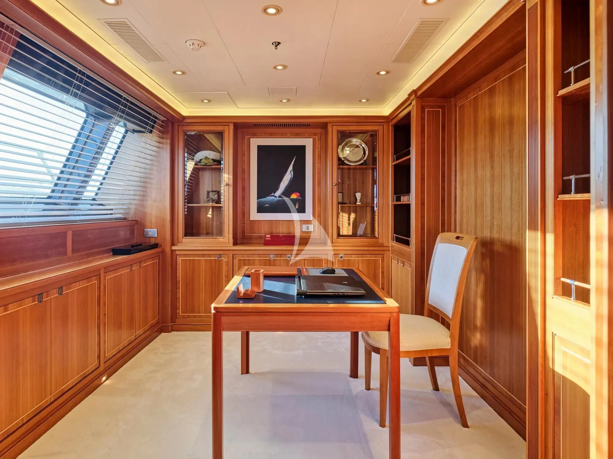 a kitchen with a table and chairs aboard BURRASCA Yacht for Sale
