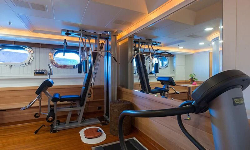 a room with a large mirror and a bench aboard BURRASCA Yacht for Sale