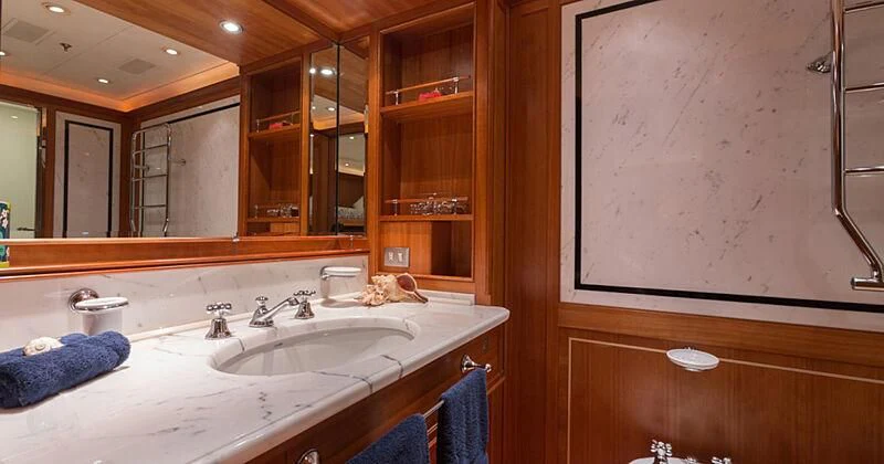 a bathroom with a sink and a mirror aboard BURRASCA Yacht for Sale