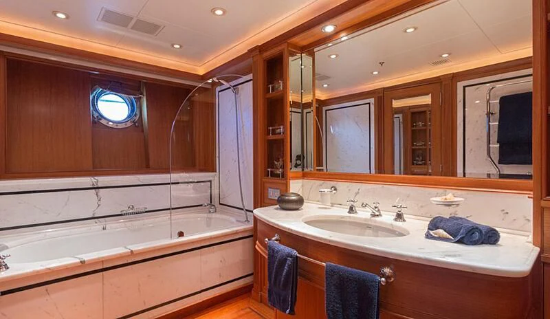 a bathroom with a large mirror aboard BURRASCA Yacht for Sale