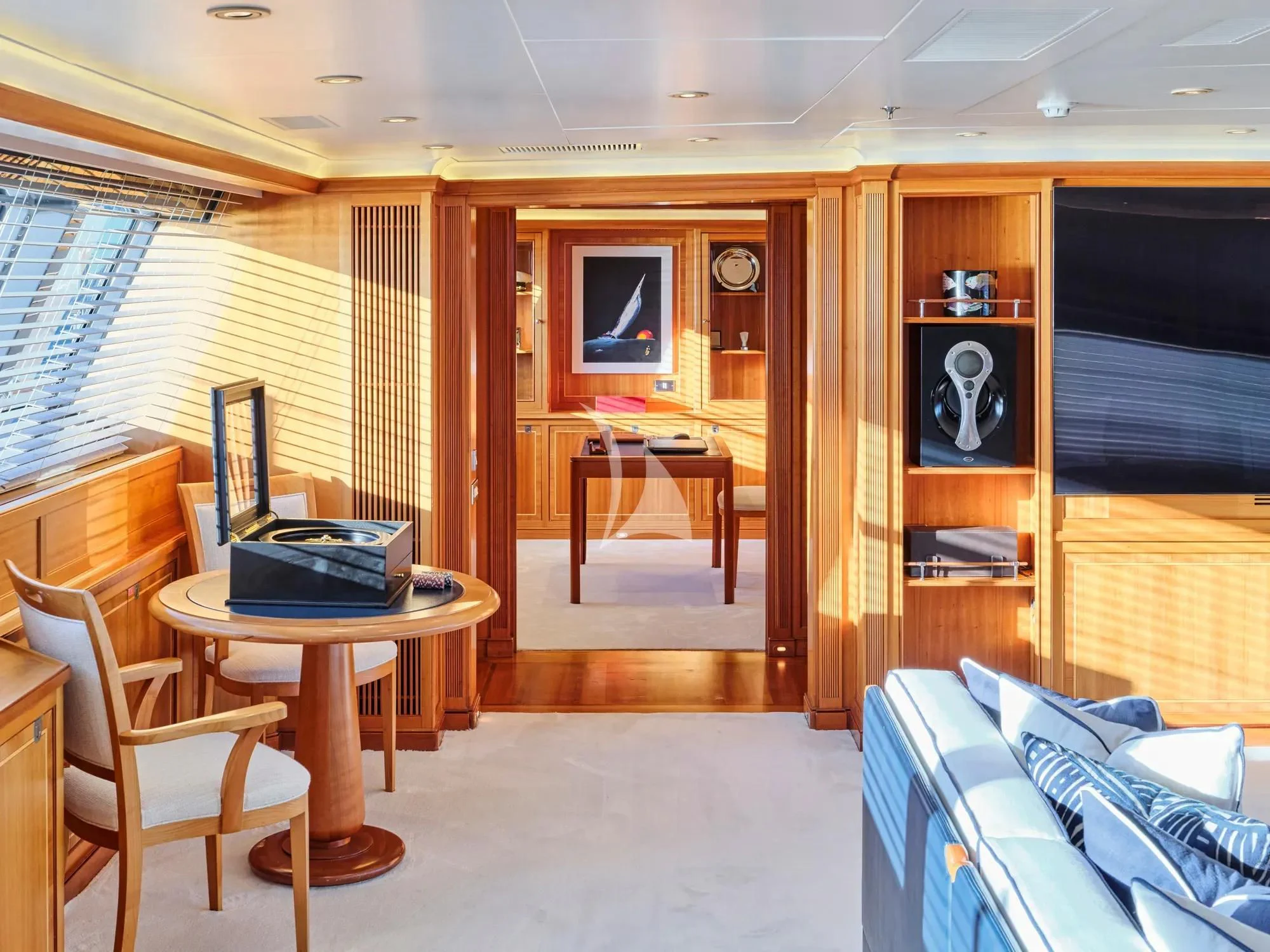 a room with a table and chairs aboard BURRASCA Yacht for Sale