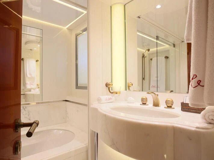 a bathroom with a large mirror aboard IL SOLE Yacht for Sale