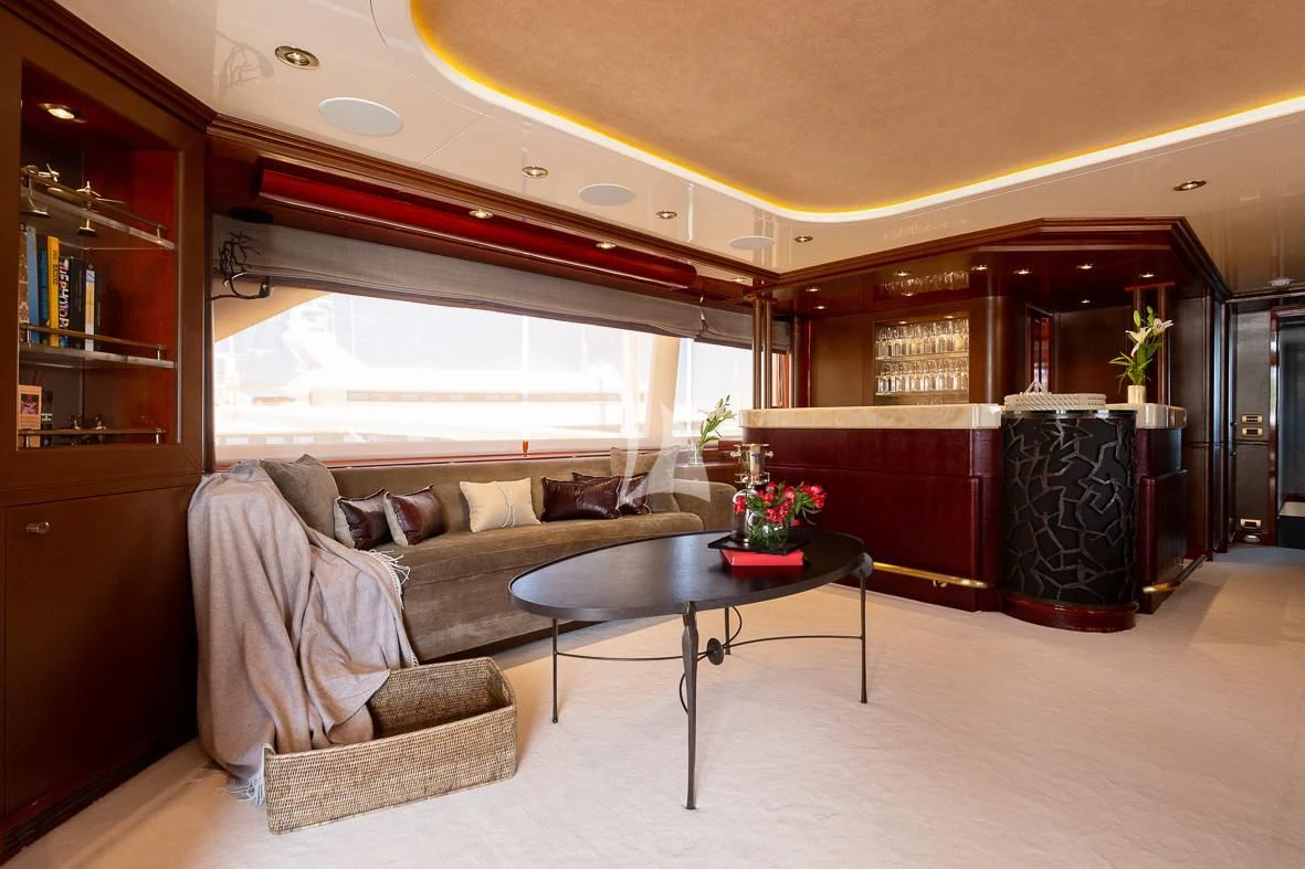 a living room with a couch and a coffee table aboard IL SOLE Yacht for Sale