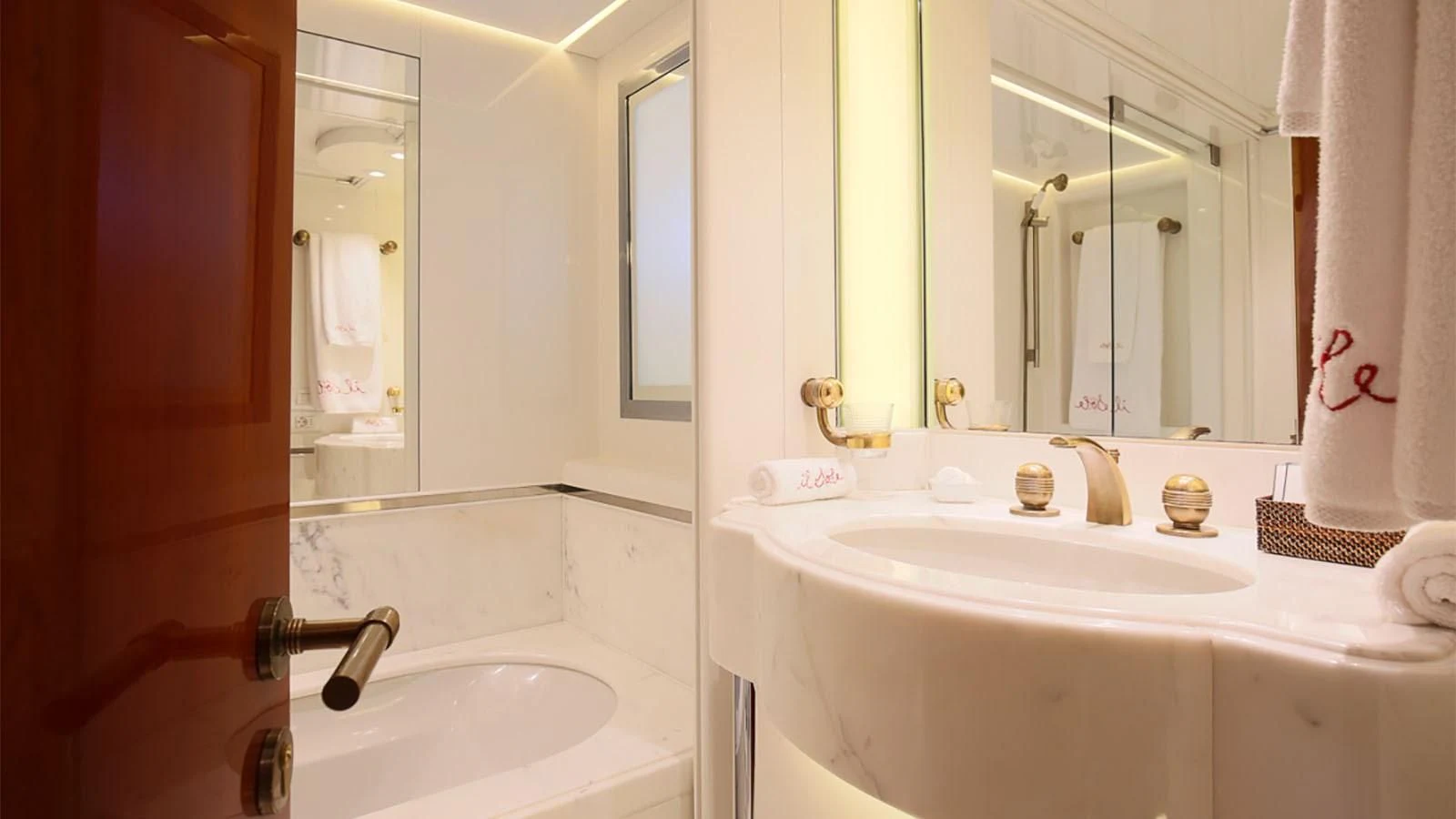 a bathroom with a sink and a mirror aboard IL SOLE Yacht for Sale