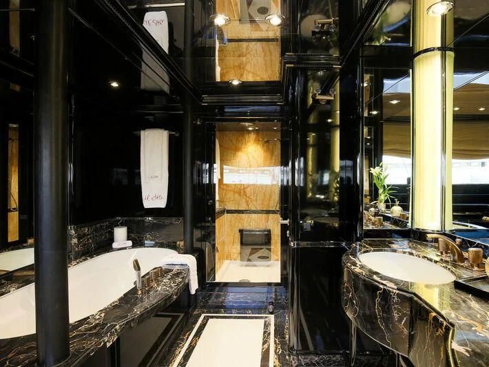 a bathroom with a large tub aboard IL SOLE Yacht for Sale