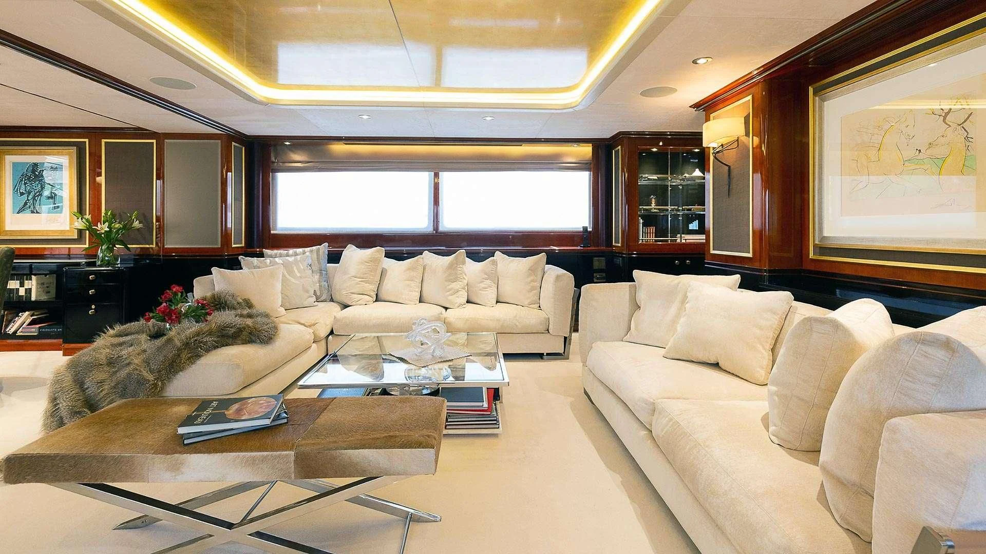 a living room with a couch and a coffee table aboard IL SOLE Yacht for Sale
