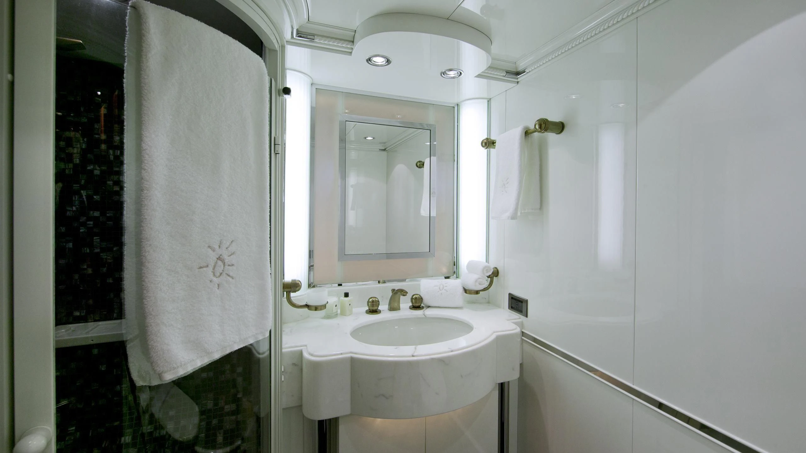 a bathroom with a sink and a mirror aboard IL SOLE Yacht for Sale