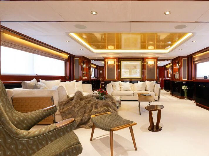 a living room with a large chandelier aboard IL SOLE Yacht for Sale