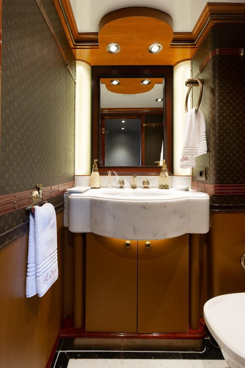 a bathroom with a sink and a mirror aboard IL SOLE Yacht for Sale