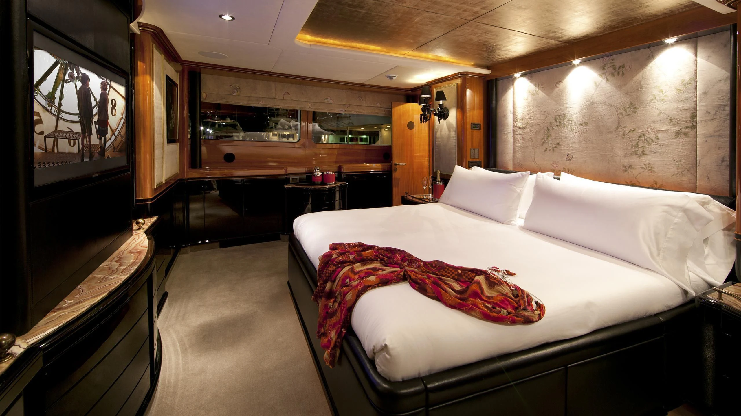 a room with a bed and a mirror aboard IL SOLE Yacht for Sale