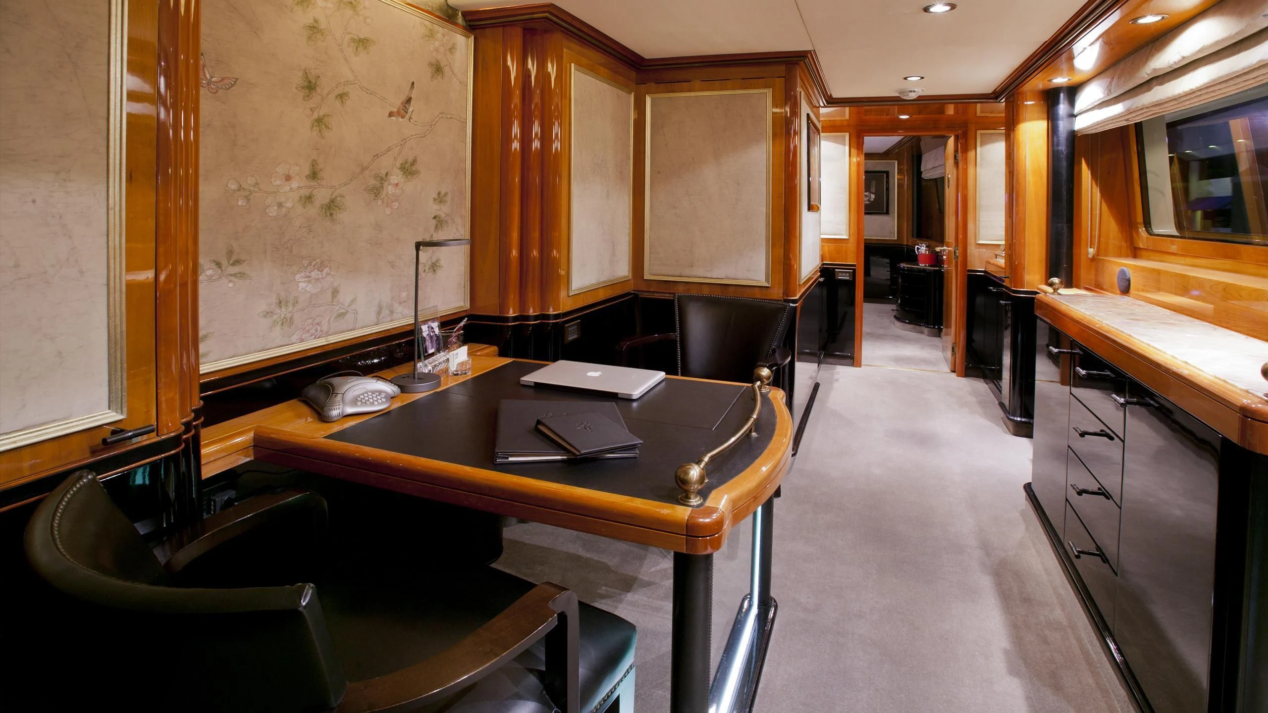 a room with a table and chairs aboard IL SOLE Yacht for Sale