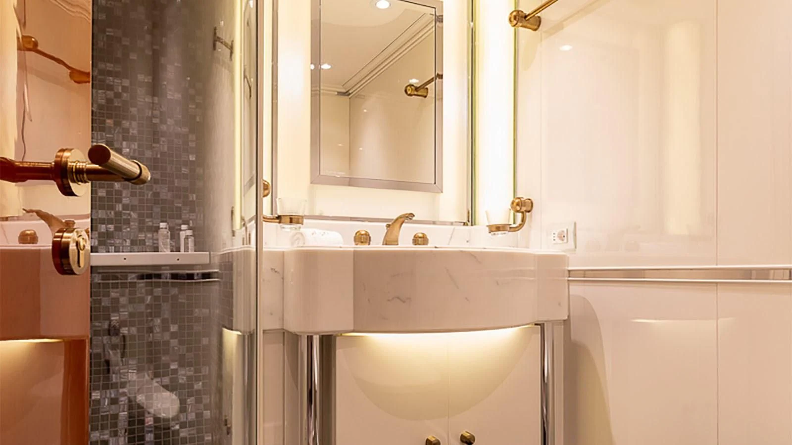 a bathroom with a sink and a mirror aboard IL SOLE Yacht for Sale