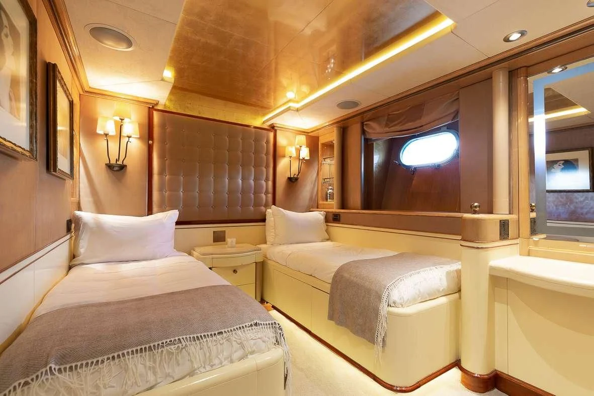 a room with two beds aboard IL SOLE Yacht for Sale