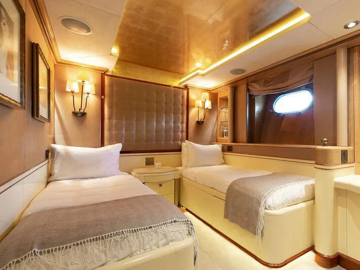 a couple of beds in a hotel room aboard IL SOLE Yacht for Sale