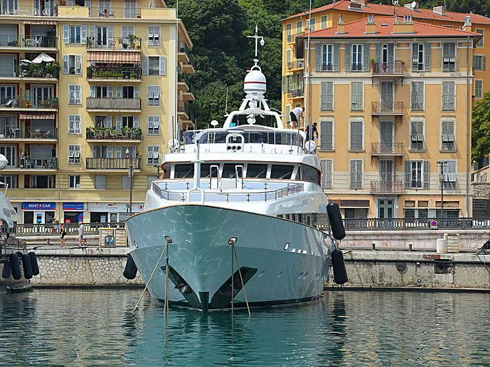 a boat is parked on the side of the water aboard IL SOLE Yacht for Sale
