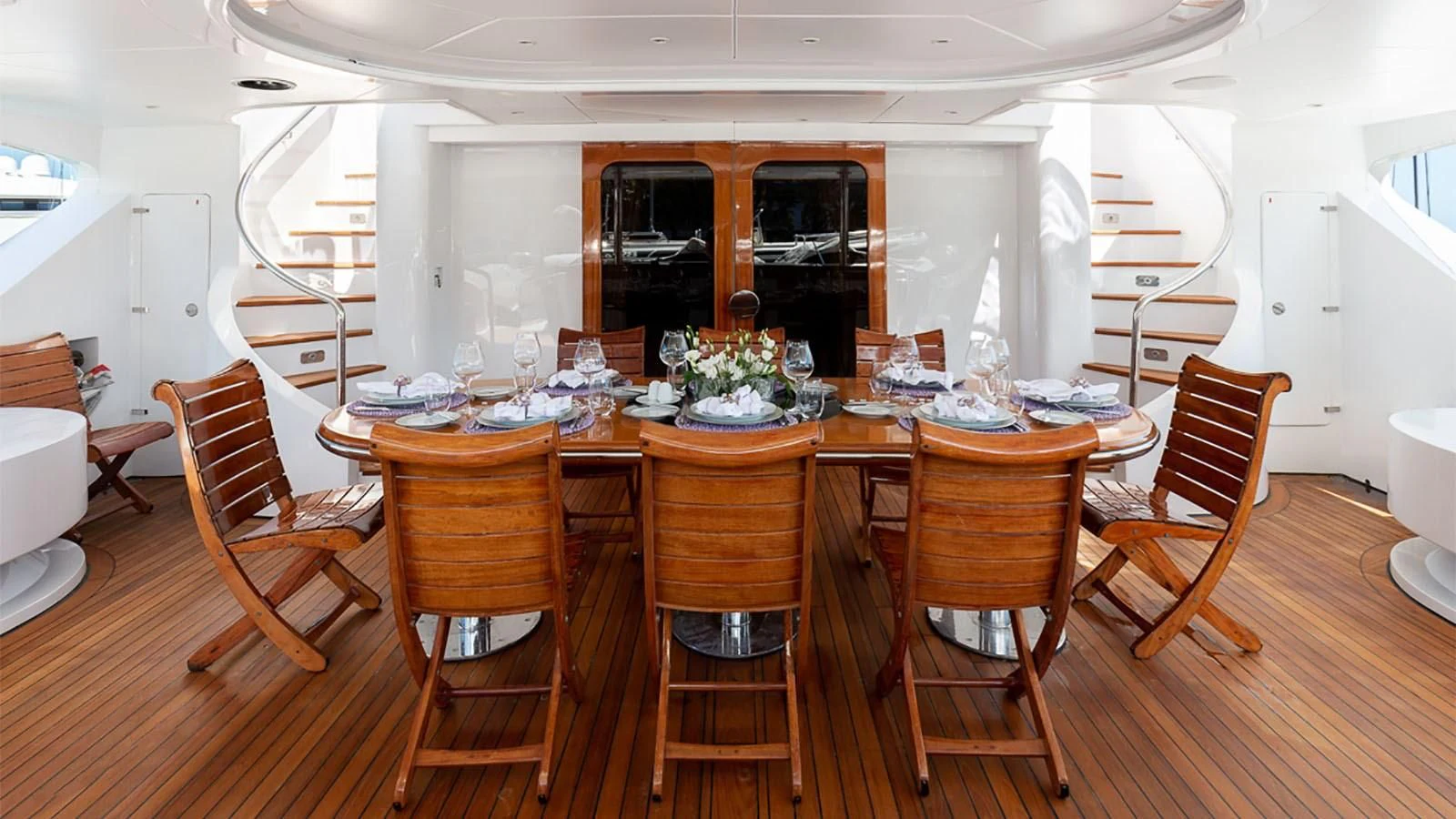 a dining room table with chairs aboard IL SOLE Yacht for Sale