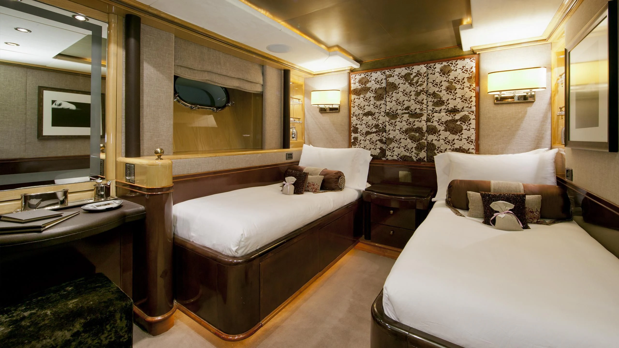 a room with a couple of beds aboard IL SOLE Yacht for Sale