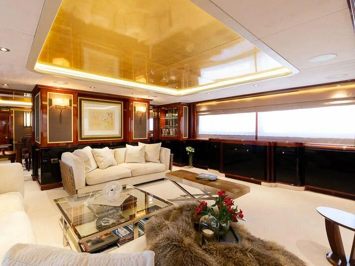 a living room with a large window aboard IL SOLE Yacht for Sale