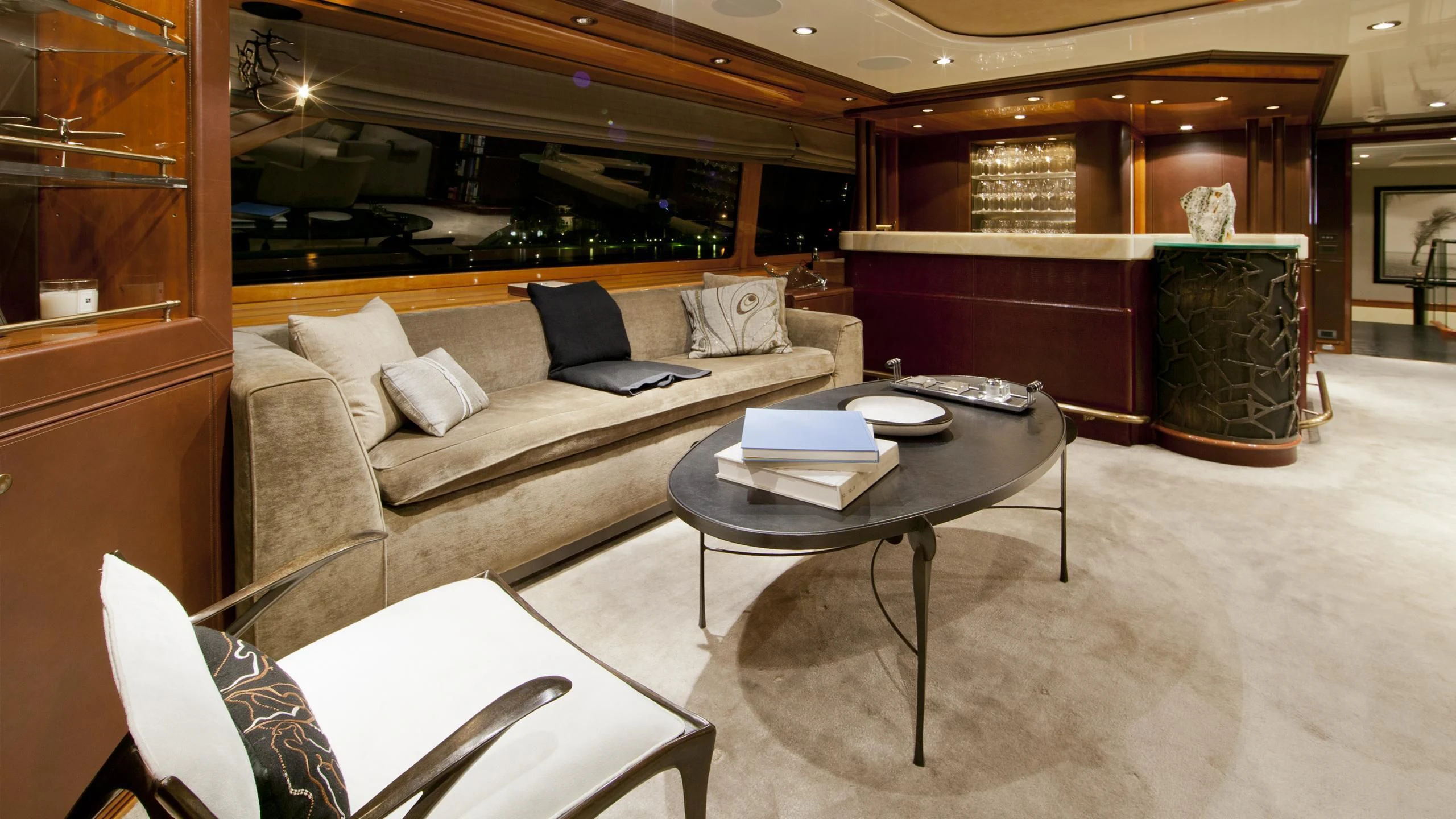 a living room with a couch and coffee table aboard IL SOLE Yacht for Sale
