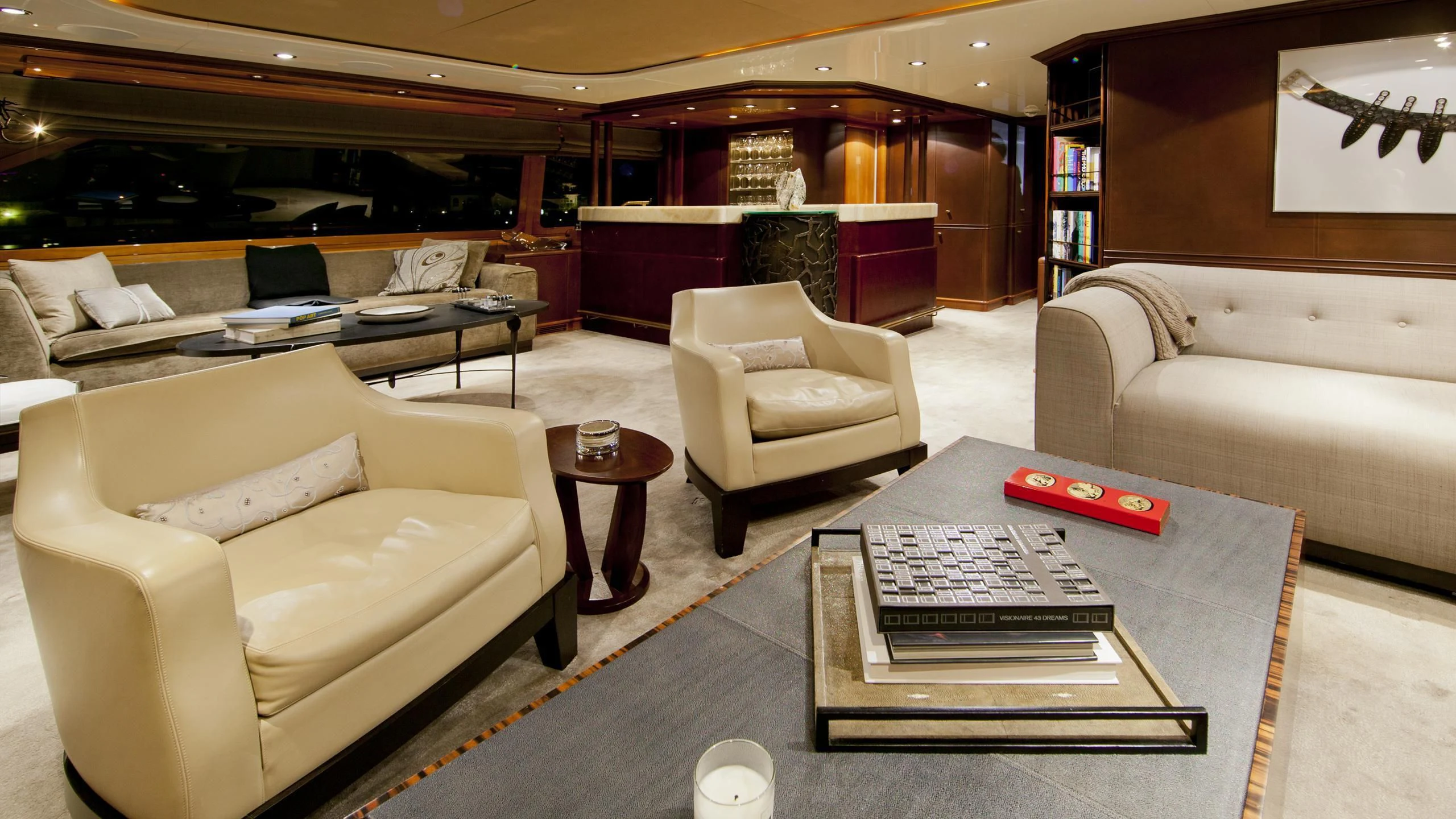 a living room with a couch and coffee table aboard IL SOLE Yacht for Sale