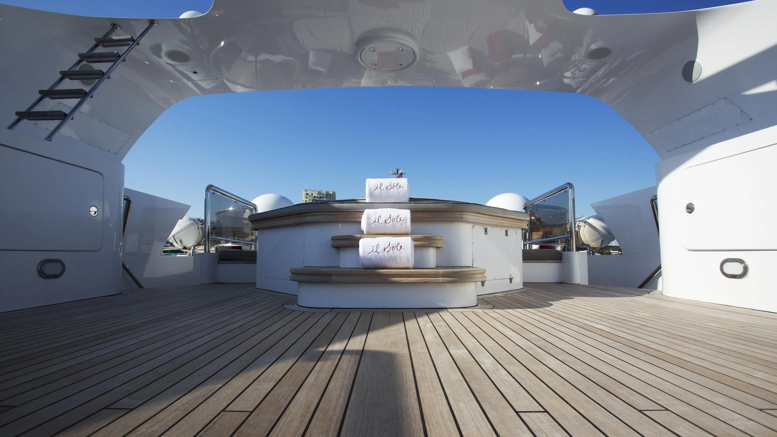 a room with a wood floor and a large white box with a blue wall and a white box aboard IL SOLE Yacht for Sale