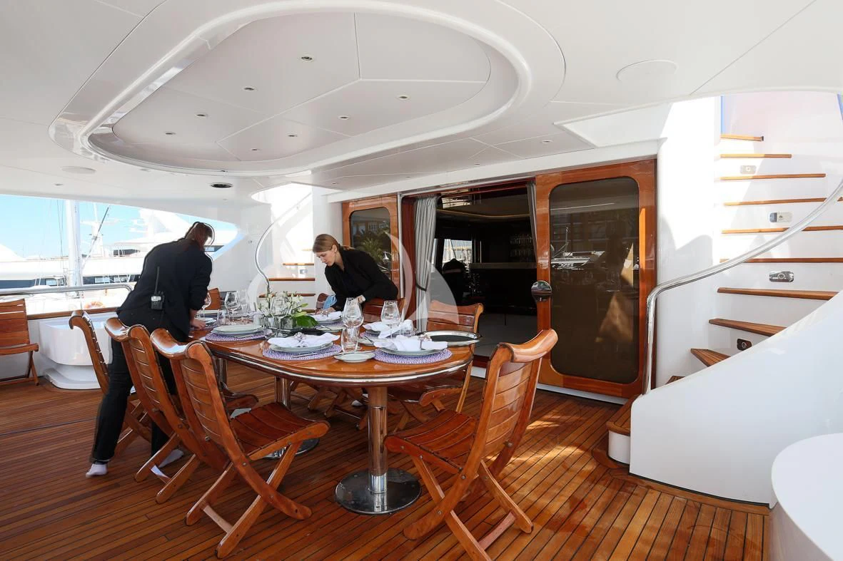 a dining room with a table and chairs aboard IL SOLE Yacht for Sale
