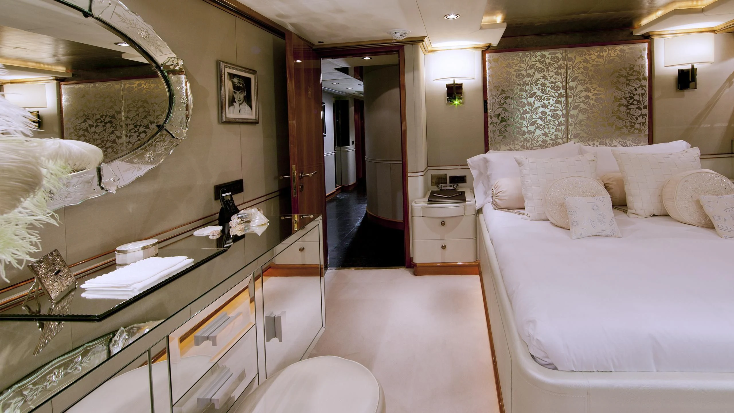a room with a bed and a mirror aboard IL SOLE Yacht for Sale