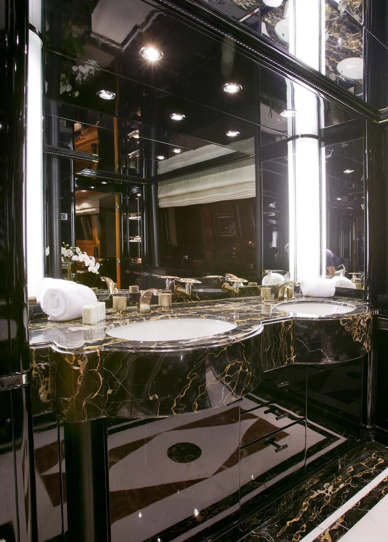 a large bathroom with a large mirror aboard IL SOLE Yacht for Sale